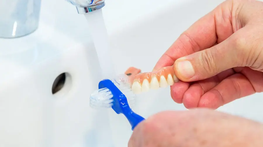 You can easily clean removable dentures